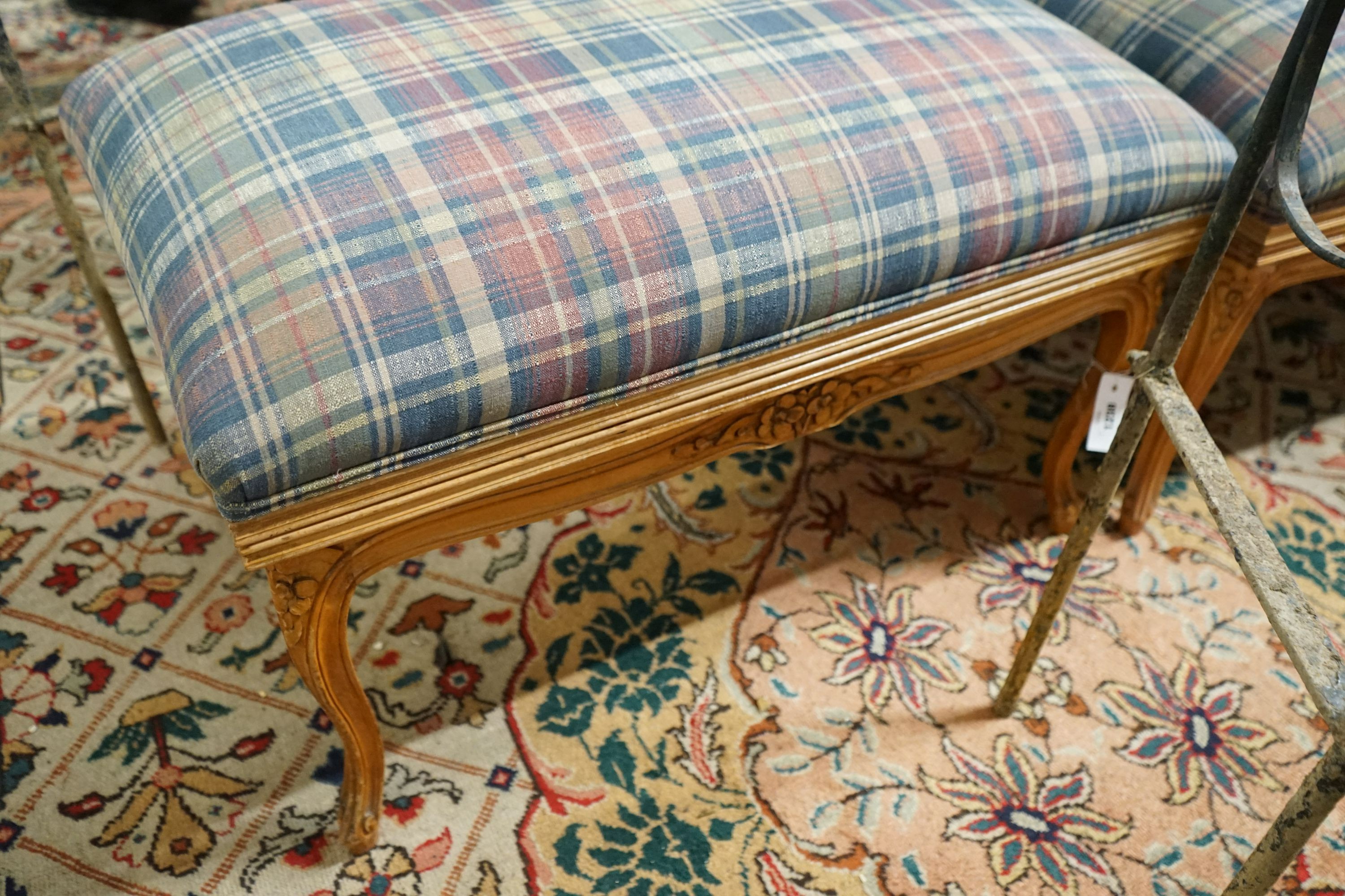 A pair of French carved beech upholstered stools combined luggage racks, width 80cm, depth 50cm, height 46cm